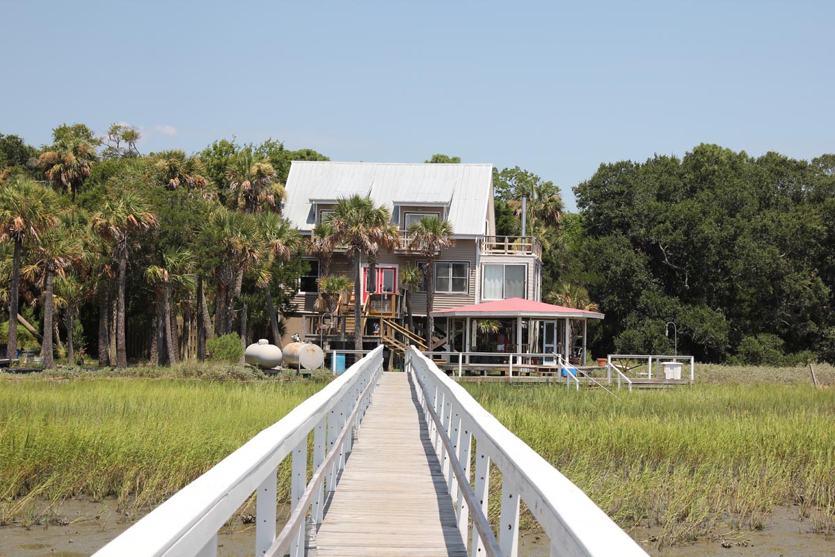 Walking the private boardwalk toward Goat Island Resort Rental House, a private island vacation rental near Isle of Palms