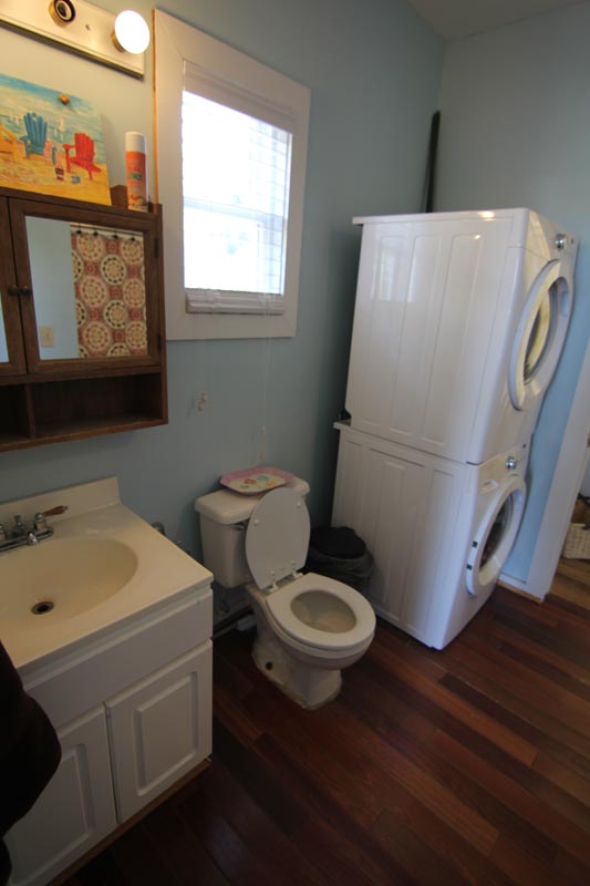 Full bathroom with washer and dryer at Goat Island Resort Rental House